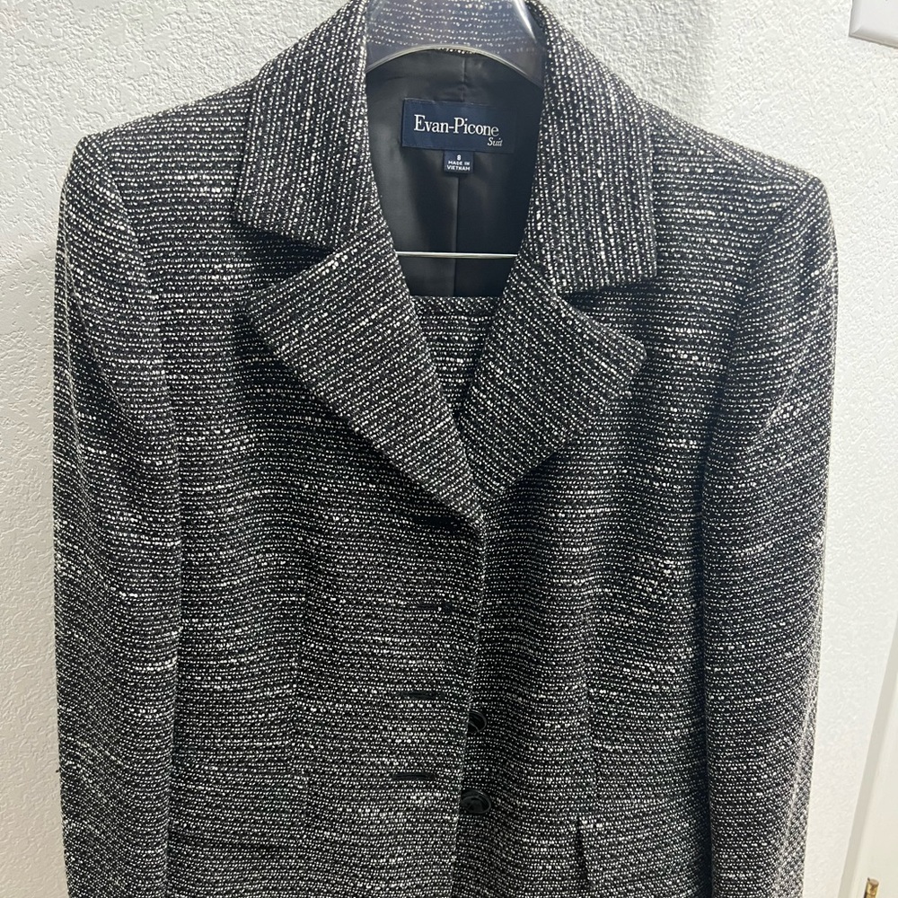 Blazer and skirt suit set.